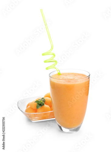 Glass with tasty melon smoothie on white background