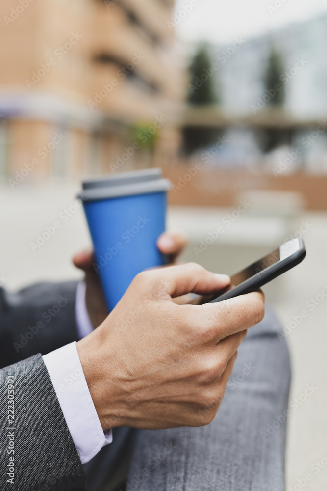 young businessman using a smartphone young businessman using a smartphone