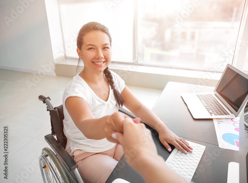 Businesswoman in wheelchair...