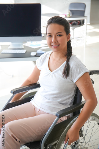 Asian woman in wheelchair i...