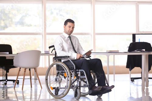 Businessman in wheelchair w...