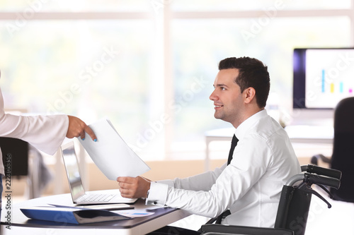 Businessman in wheelchair w...