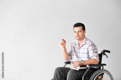Male teacher in wheelchair ...