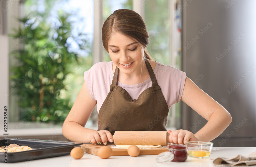 Woman preparing tasty croissants in kitchen Woman preparing tasty croissants in kitchen