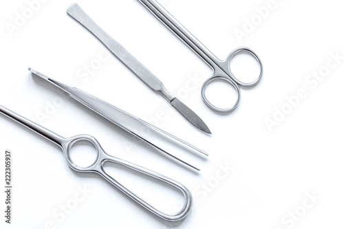 instruments for cosmetic surgery on white background top view