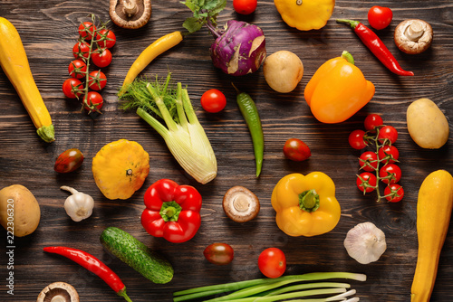 Flat lay composition with fresh vegetables on wooden background