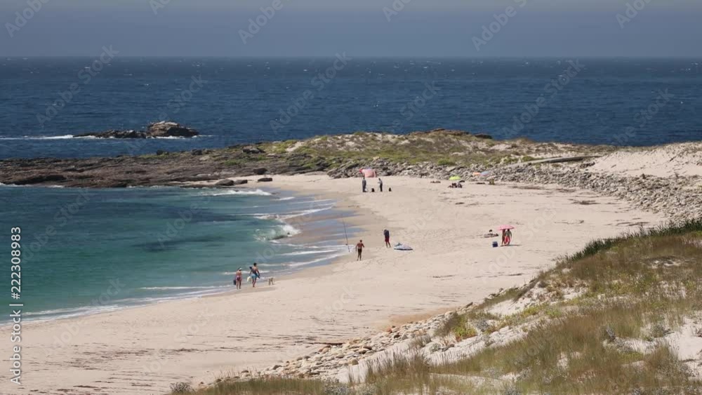 the beautiful larino beach on the coast of galicia, spain the beautiful larino beach on the coast of galicia, spain