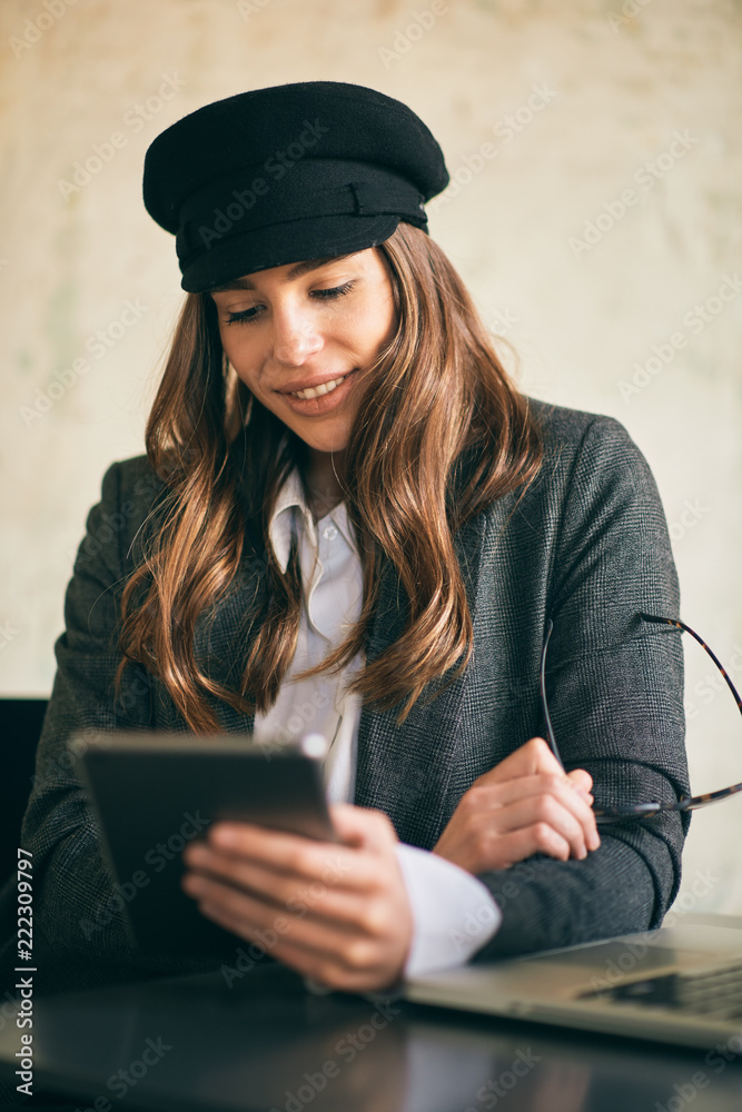 custom made wallpaper toronto digitalYoung modern woman sitting in cafe and using laptop.