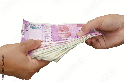 Indian rupees. Holding and giving Indian rupees to someone