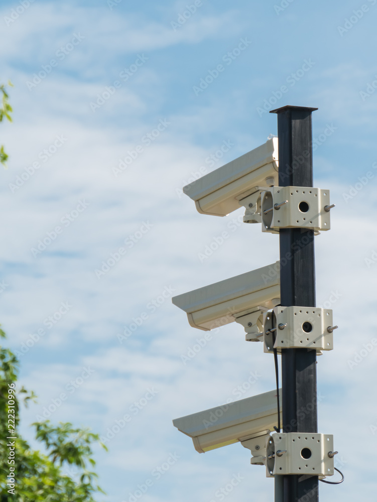 closed-circuit camera on white clouds background and blurred tree background, Vertical CCTV, closed-circuit camera on white clouds background and blurred tree background, Vertical CCTV,