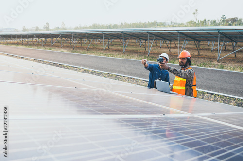 Wallpaper Mural engineer working on checking equipment in solar power plant Torontodigital.ca