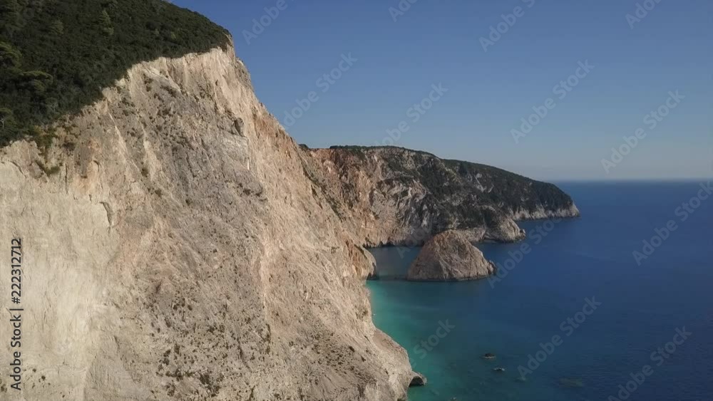 Amazing beach and steep cliffs in an aerial view turquoise and blue water Amazing beach and steep cliffs in an aerial view turquoise and blue water