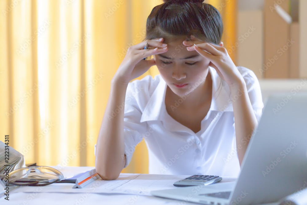 Obraz premium beautiful young lady feeling headache from design blueprint and office works. worried work not complete ontime