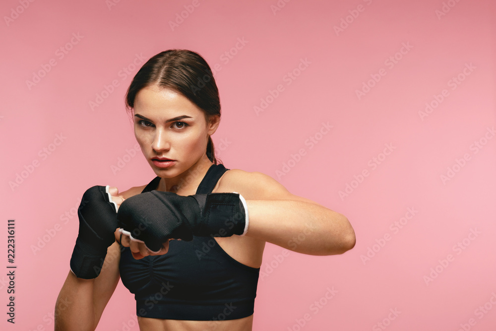 Female Boxer. Sportswoman Training In Boxing Bandages Female Boxer. Sportswoman Training In Boxing Bandages