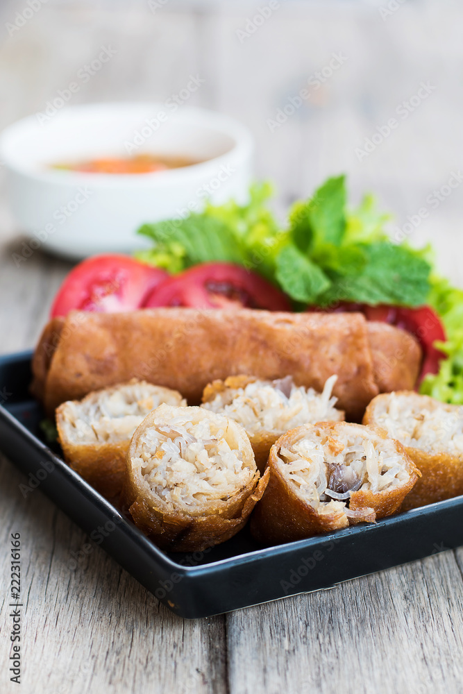 spring roll food in black dish