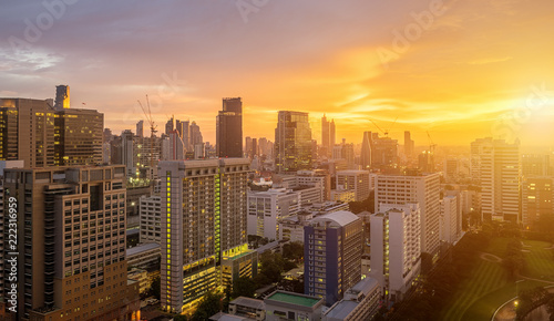 Bangkok City skyline with urban skyscrapers at sunset.
