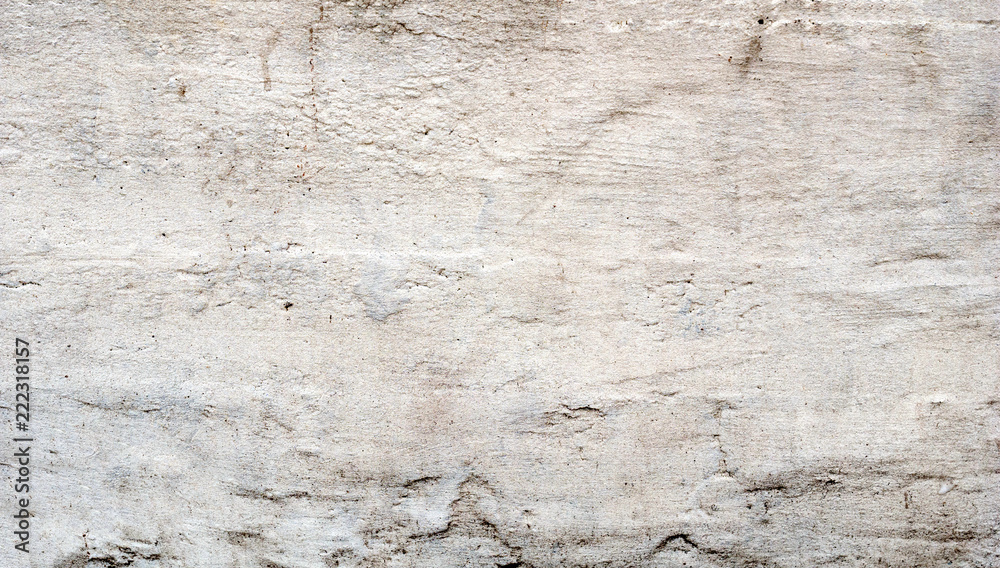 Obraz premium The wall of the old house. Cracks on the surface. Background