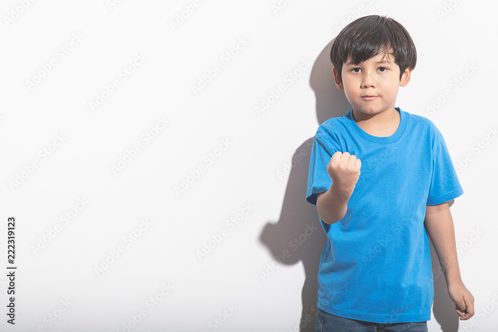 Young boy portrait in white background with hard light. Young boy portrait in white background with hard light.