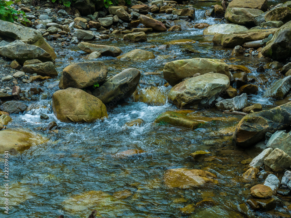 Mountain waterfall with blue, clear water. Summer background Mountain waterfall with blue, clear water. Summer background
