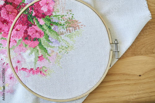 Konstfotografi Hoop with aida with a fragment of an embroidery
