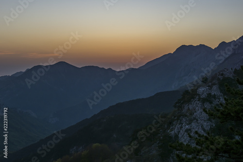 Mountain during sunset. Landscape rocky mountains national park  Paklenica  in Croatia. Peaks of rocky hills with occasionally vegetation.