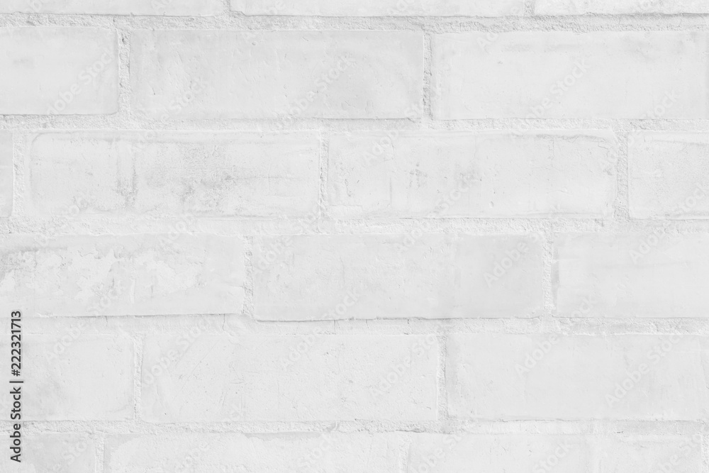 Grey and white brick wall texture background. Brickwork or stonework flooring interior rock old pattern clean concrete grid uneven bricks design stack. Grey and white brick wall texture background. Brickwork or stonework flooring interior rock old pattern clean concrete grid uneven bricks design stack.