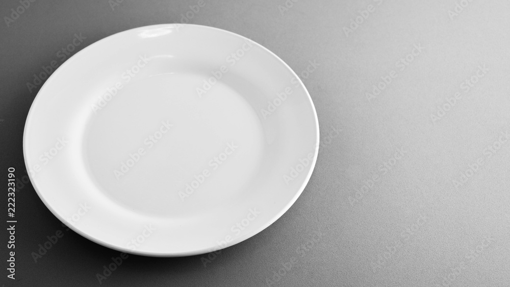 Empty white ceramic dish - monochrome Empty white ceramic dish - monochrome