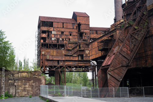 Old rusty industrial builing in The Lower Vitkovice, Ostrava, Czech Republic / Czechia - ruin of abandoned historical mettalurgy industry. photo