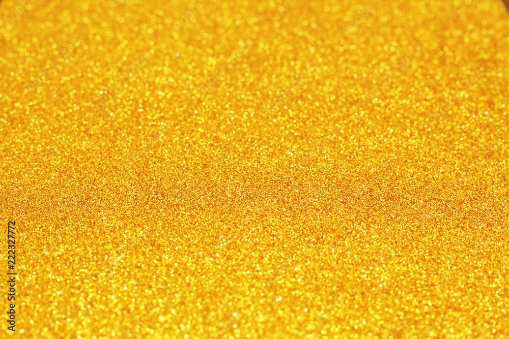 Light golden background, glitter, selective focus