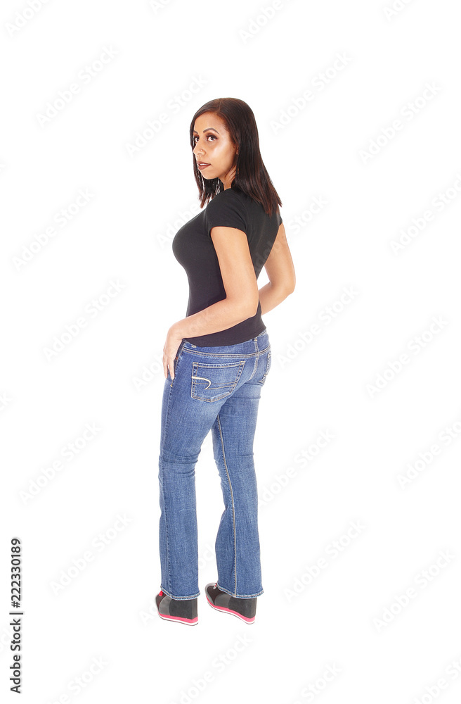 Tall woman standing in jeans from the back Tall woman standing in jeans from the back