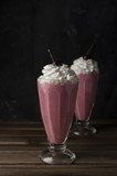 Cherry milkshake with whipped cream and cherries