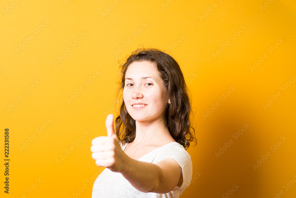 Girl showing thumbs up, everything is super cool Girl showing thumbs up, everything is super cool