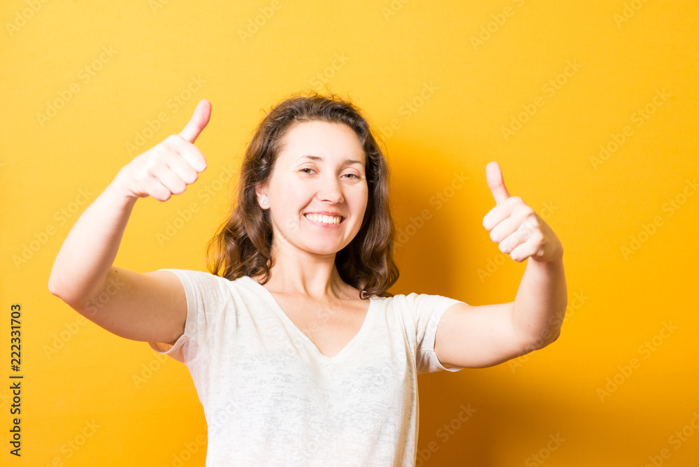 Girl showing thumbs up, everything is super cool Girl showing thumbs up, everything is super cool