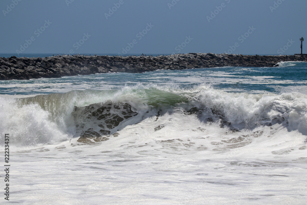 Large wave crashing at The Wedge in Newport Beach