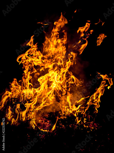 Bright large fire from a bonfire that burns at night_