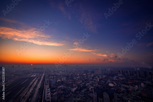 Sunrise scene above the city with city lights and traffic lights and illuminated buildings from Bararab overpass