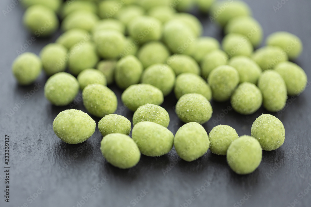 Snack, peanuts in the coating of wasabi. Close up Snack, peanuts in the coating of wasabi. Close up