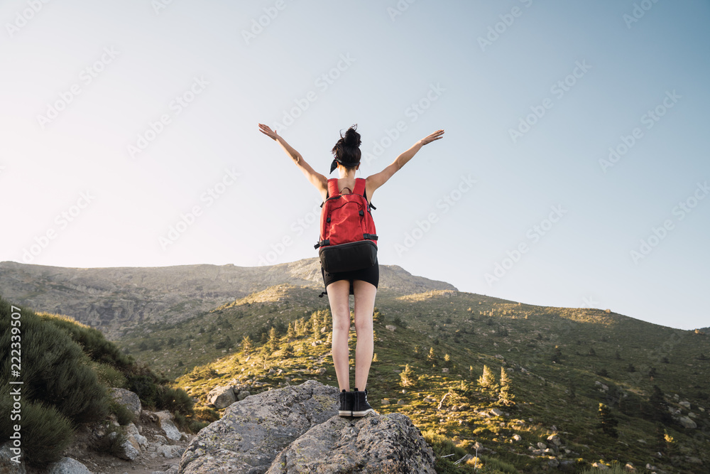Young woman with backpack enjoying nature Young woman with backpack enjoying nature
