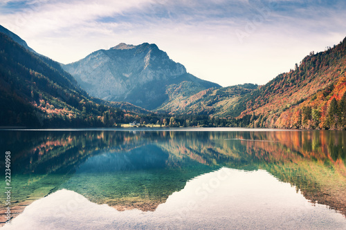 Mountain lake with reflections. Vorderer Langbathsee lake in autumn Alps, Austria.