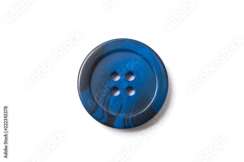closeup of blue sewing buttons on white background