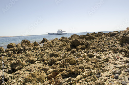 stony shore and blue sea photo