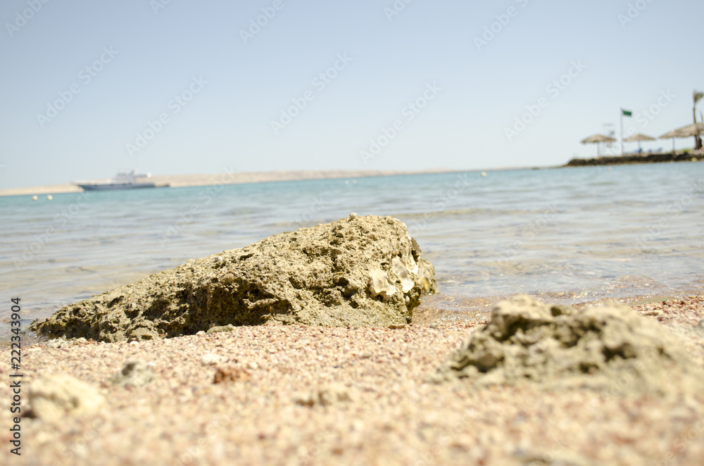 stony shore and blue sea
