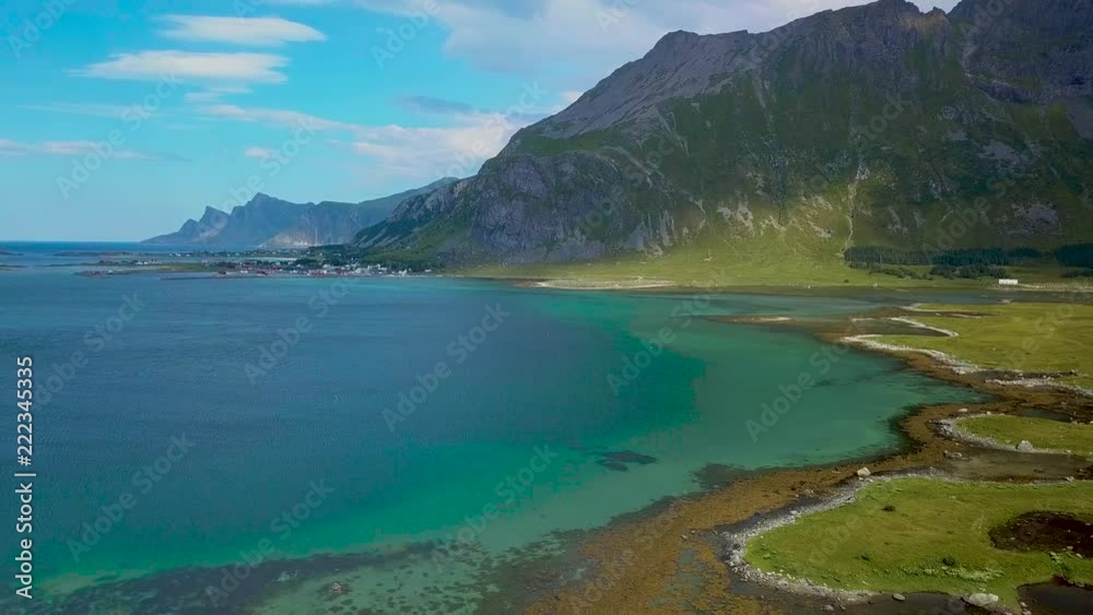 Flight over the sea coast of Norway. Sunny weather and beautiful views of the bay and the mountains. Lofoten Islands. 4k Flight over the sea coast of Norway. Sunny weather and beautiful views of the bay and the mountains. Lofoten Islands. 4k