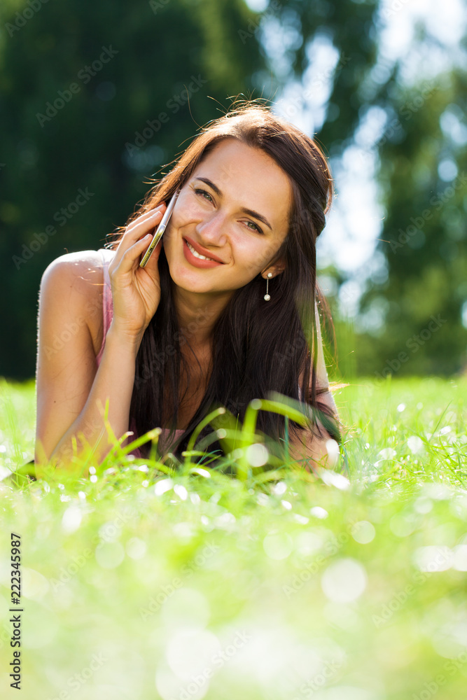 Happy beautiful brunette girl calling by phone Happy beautiful brunette girl calling by phone