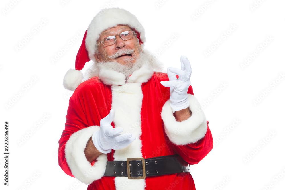 Christmas. Good Santa Claus in white gloves shows faces, grimaces, shows his tongue. Not standard behavior. Isolated on white background.