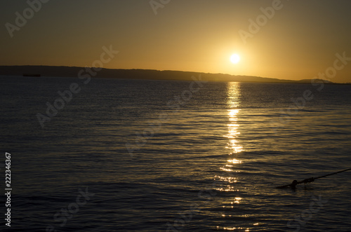 a yellow sunset over the sea