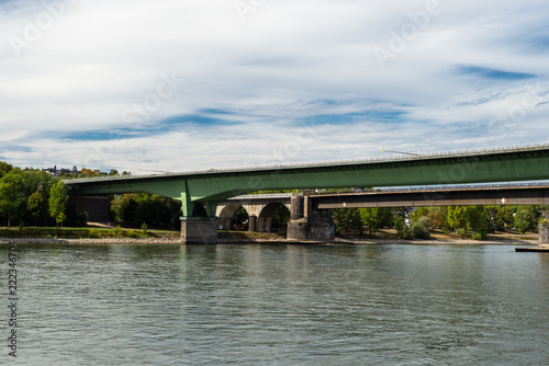 Concrete road bridge on the highway over a river in western Germany on a background of blue sky.