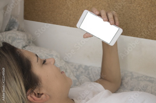 Woman using a phone screen shows mockup photo