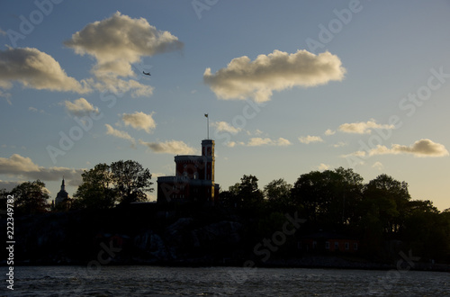 Boats and landmarks at Stockholm waterfront at sunset