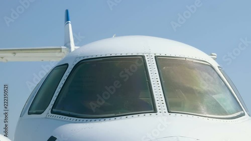 Medium shot of a cockpit of a passenger airplane located at the airport. 4K photo